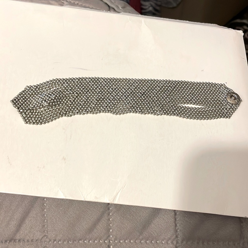 Silver color bracelet.